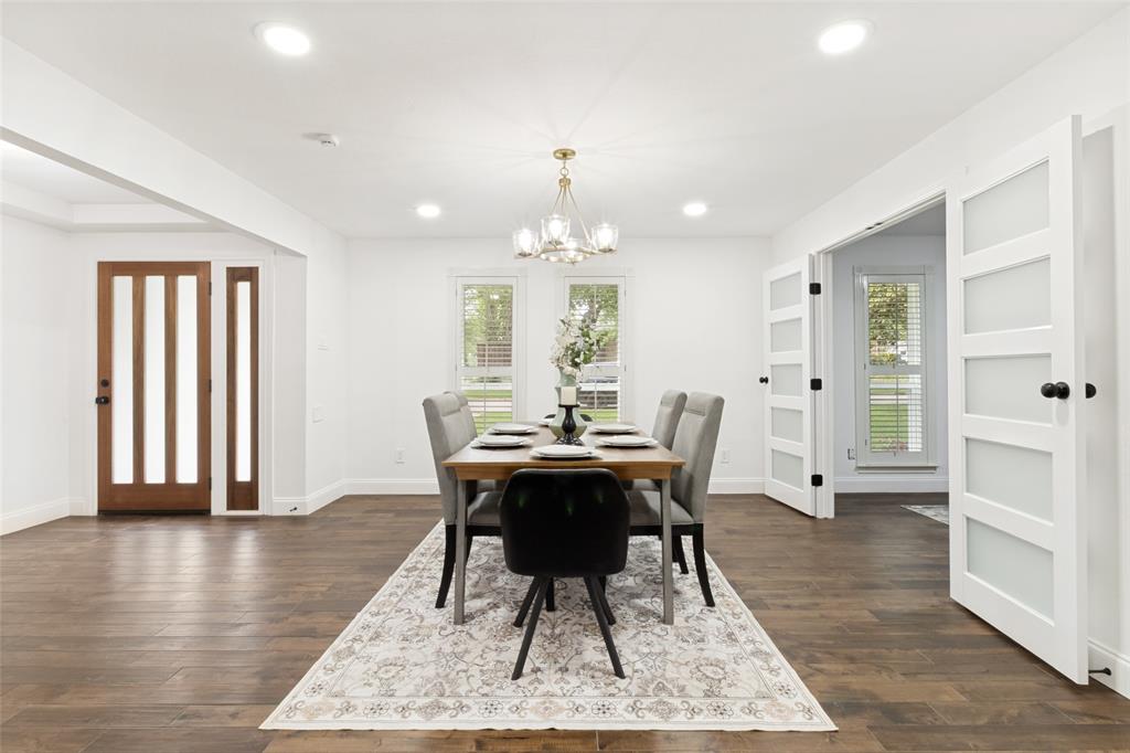 9552 Timberleaf Drive Dallas, TX 75243 - Photo 5 of 32 a dining room with wooden floor and a rug