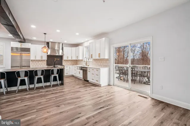 a view of an empty room with window and fireplace