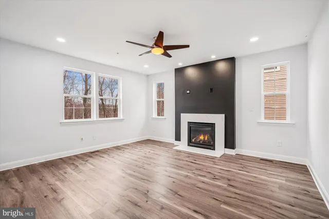 a view of a deck with wooden floor and outdoor seating