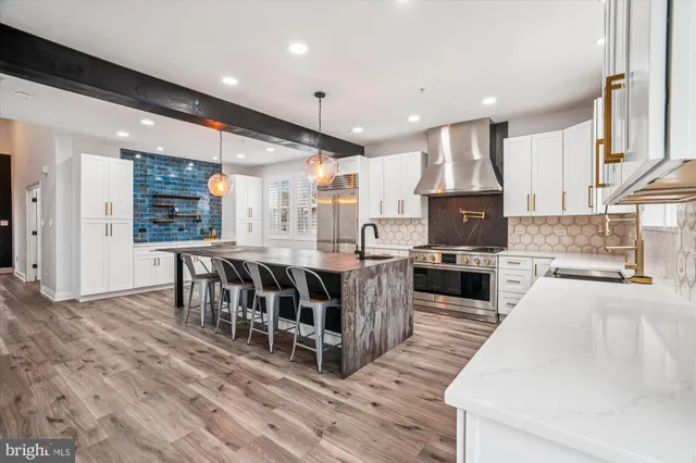 a kitchen with a stove and a sink
