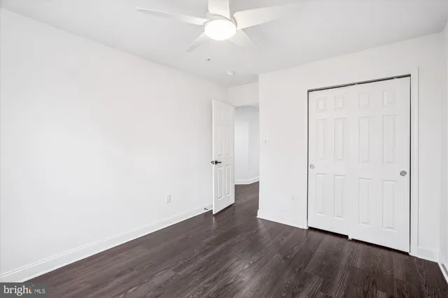 a view of an empty room and wooden floor