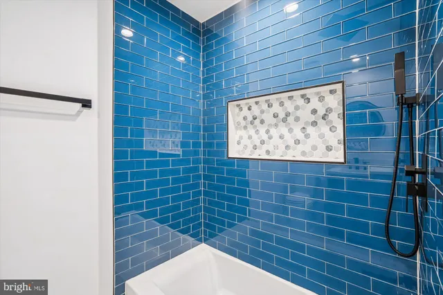 a picture of a bench in front of a wall