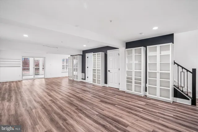 a front view of a house with a garden and yard