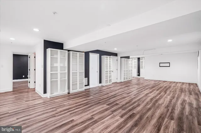 a blue bench sitting in front of a building