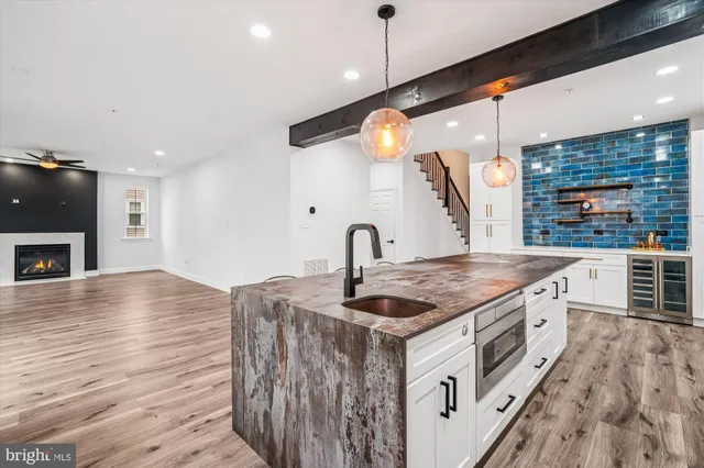 a kitchen with stainless steel appliances a refrigerator and cabinets
