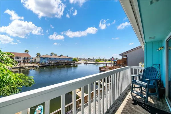a view of a lake from a balcony
