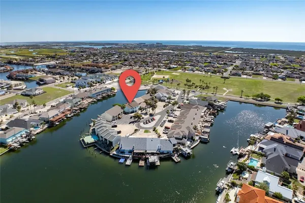 an aerial view of a house with a ocean view