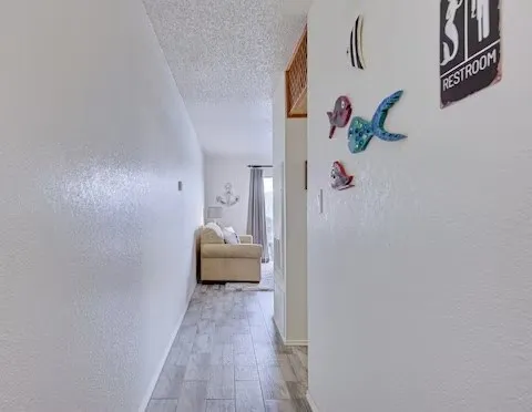 a view of a bedroom from a hallway