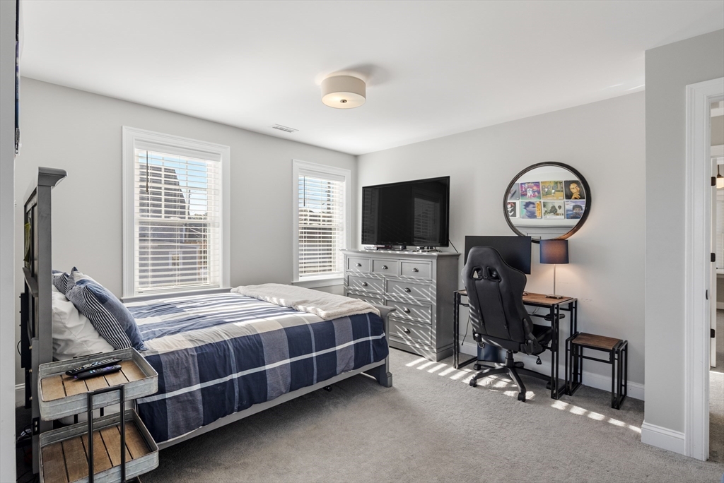 16 R Gannett Road Scituate, MA 02066 - Photo 11 of 22 a bedroom with bed tv and a window