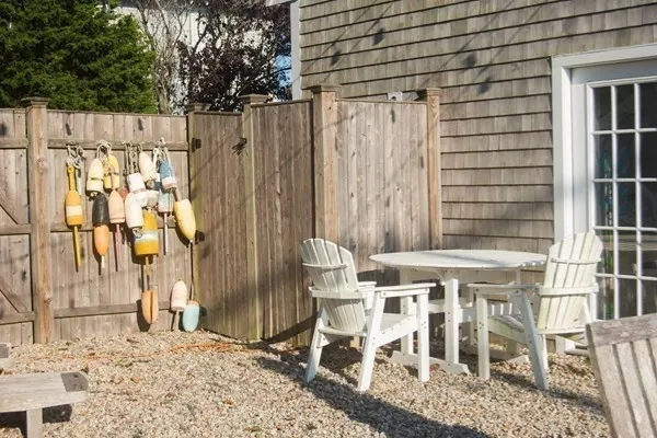 a view of a chair and table in the patio