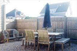 16 R Gannett Road Scituate, MA 02066 - Photo 17 of 22 a view of a chair and table in the patio