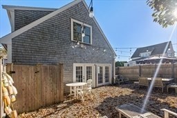 16 R Gannett Road Scituate, MA 02066 - Photo 22 of 22 a backyard of a house with large tree