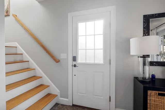 a view of entryway with wooden floor