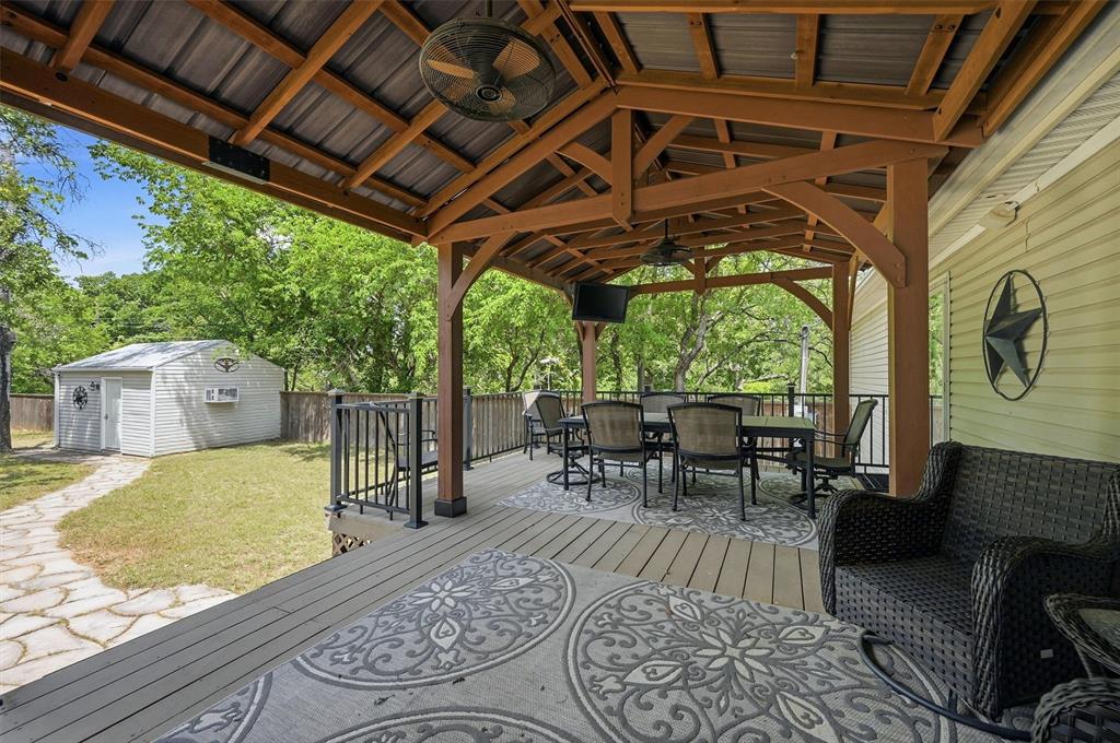 212 Sunset Road Pottsboro, TX 75076 - Photo 26 of 40 a view of a porch with furniture and a yard