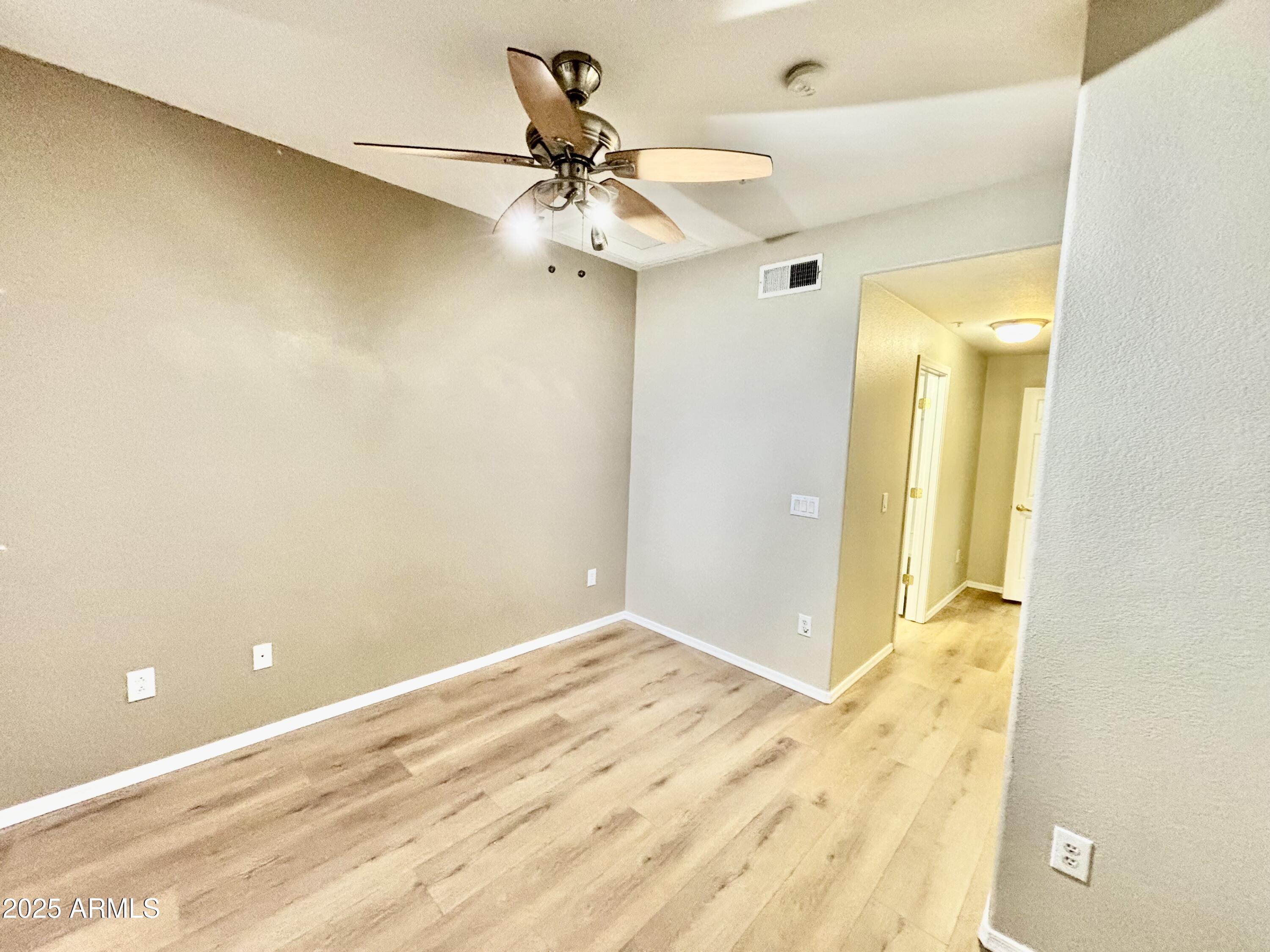18250 North Cave Creek Road, Unit 129 Phoenix, AZ 85032 - Photo 11 of 14 a view of a big room with wooden floor