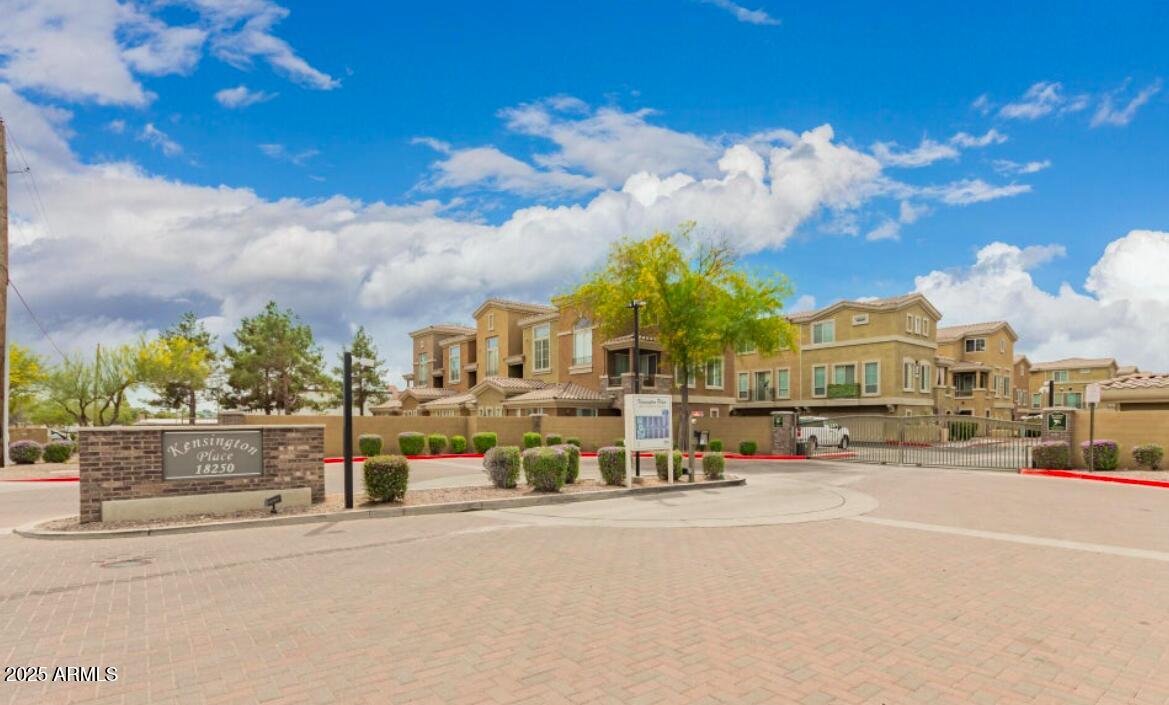 18250 North Cave Creek Road, Unit 129 Phoenix, AZ 85032 - Photo 14 of 14 a view of a street with a building in the background