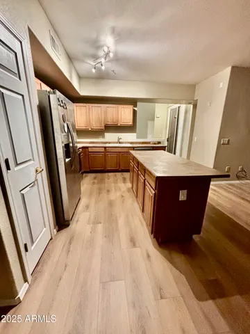 a view of a kitchen with car parked