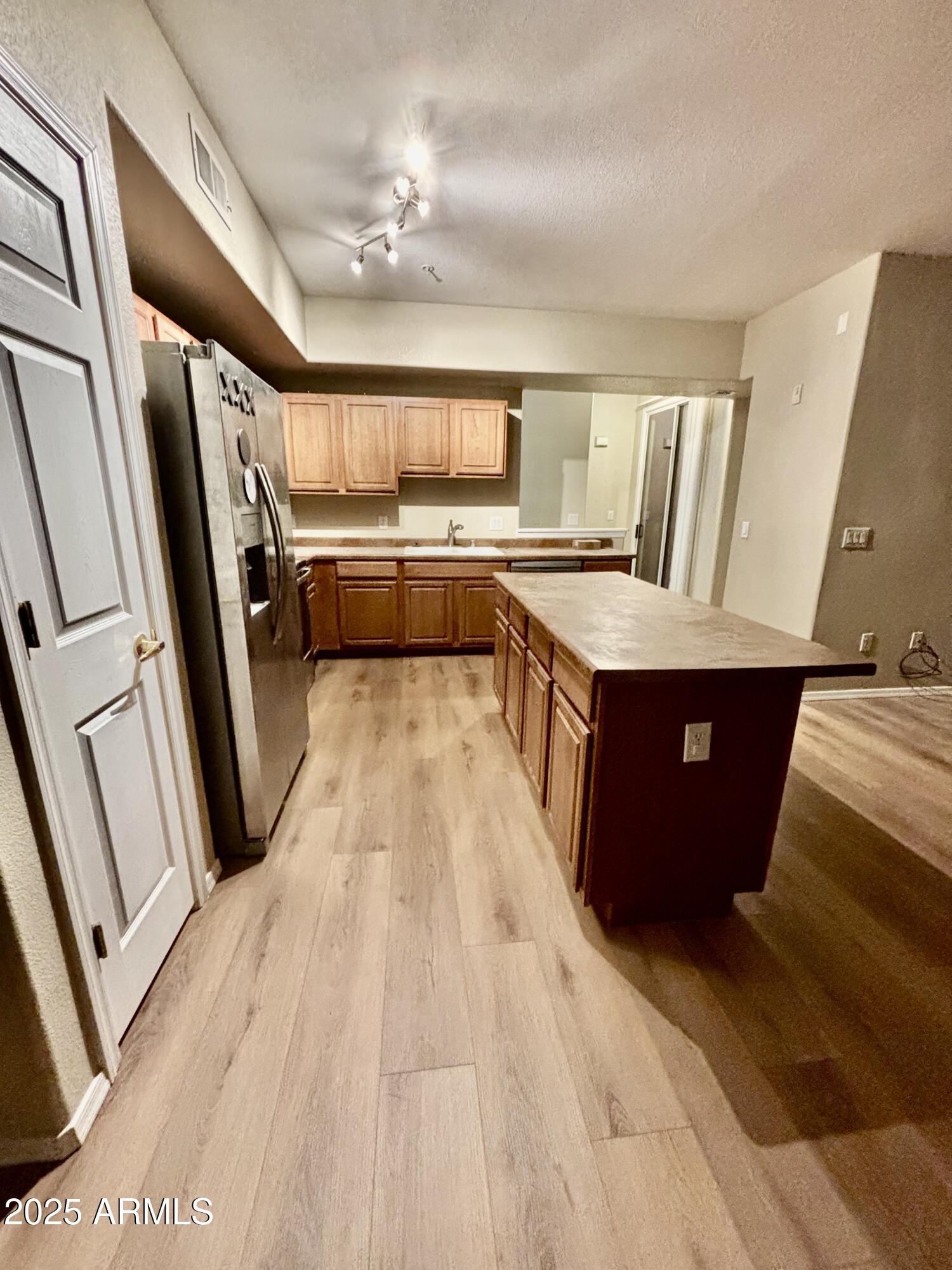 18250 North Cave Creek Road, Unit 129 Phoenix, AZ 85032 - Photo 3 of 14 a view of a kitchen with car parked