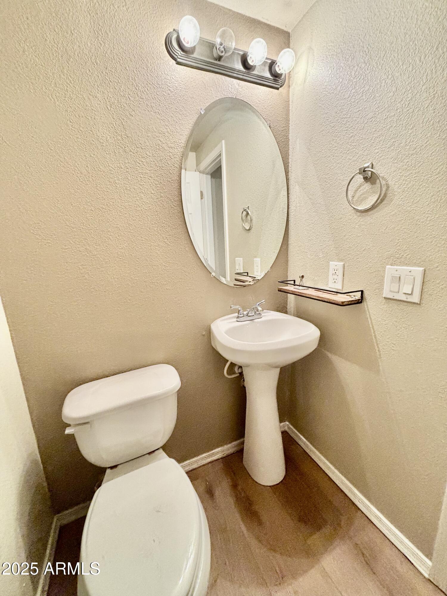 18250 North Cave Creek Road, Unit 129 Phoenix, AZ 85032 - Photo 6 of 14 a bathroom with a toilet sink and mirror