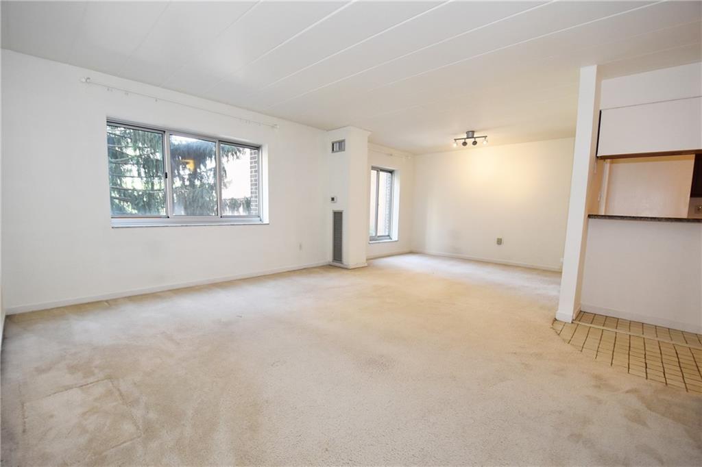 5 Bayard Road, Unit 210 Pittsburgh, PA 15213 - Photo 4 of 22 an empty room with windows