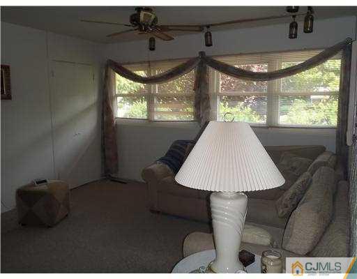21 Rumson Road Kendall Park, NJ 08824 - Photo 8 of 16 a view of a livingroom with furniture and window