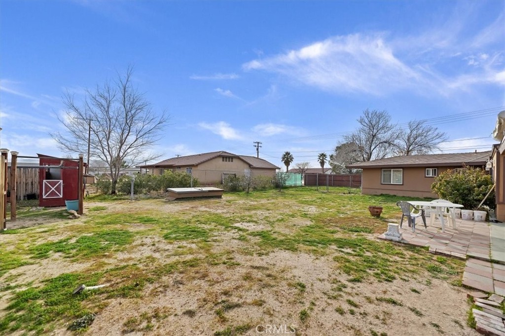 13285 Mesquite Road Apple Valley, CA 92308 - Photo 18 of 33 a view of a house with a yard