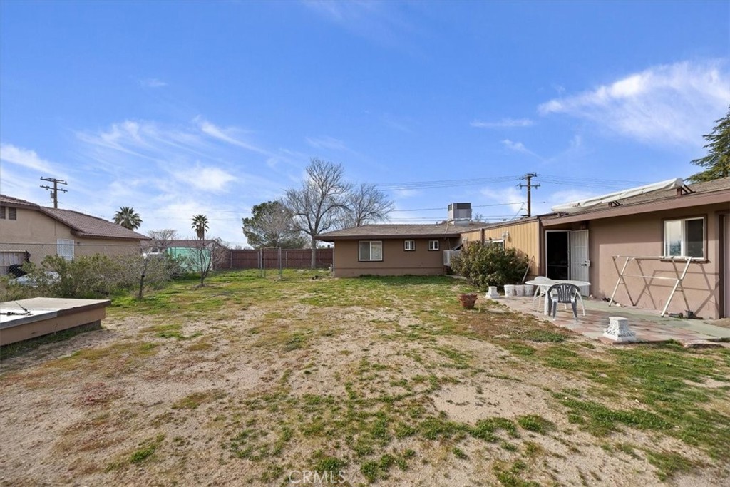 13285 Mesquite Road Apple Valley, CA 92308 - Photo 19 of 33 a view of a house with a yard