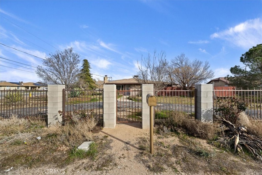 13285 Mesquite Road Apple Valley, CA 92308 - Photo 28 of 33 a view of a house with a outdoor space