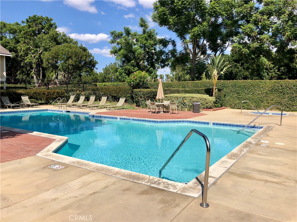 16 Prescott Irvine, CA 92620 - Photo 1 of 23 a view of a backyard with lawn chairs under an umbrella