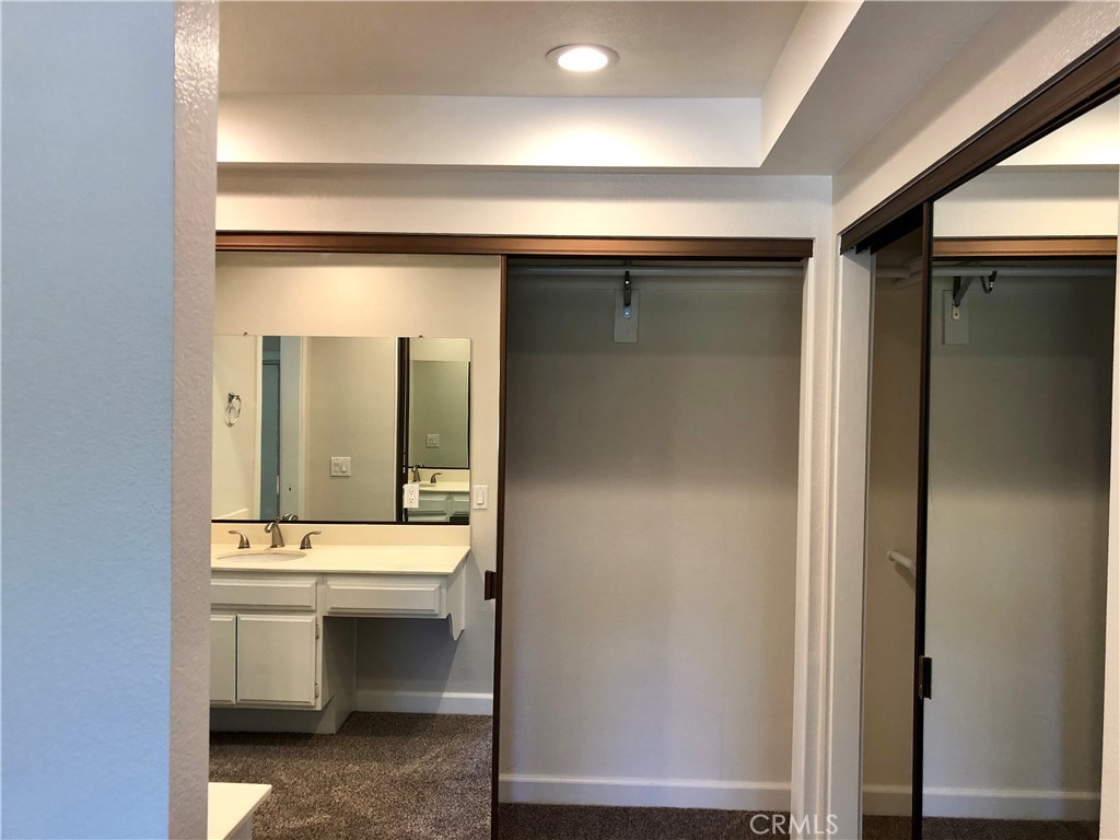 16 Prescott Irvine, CA 92620 - Photo 15 of 23 a bathroom with a sink and a mirror