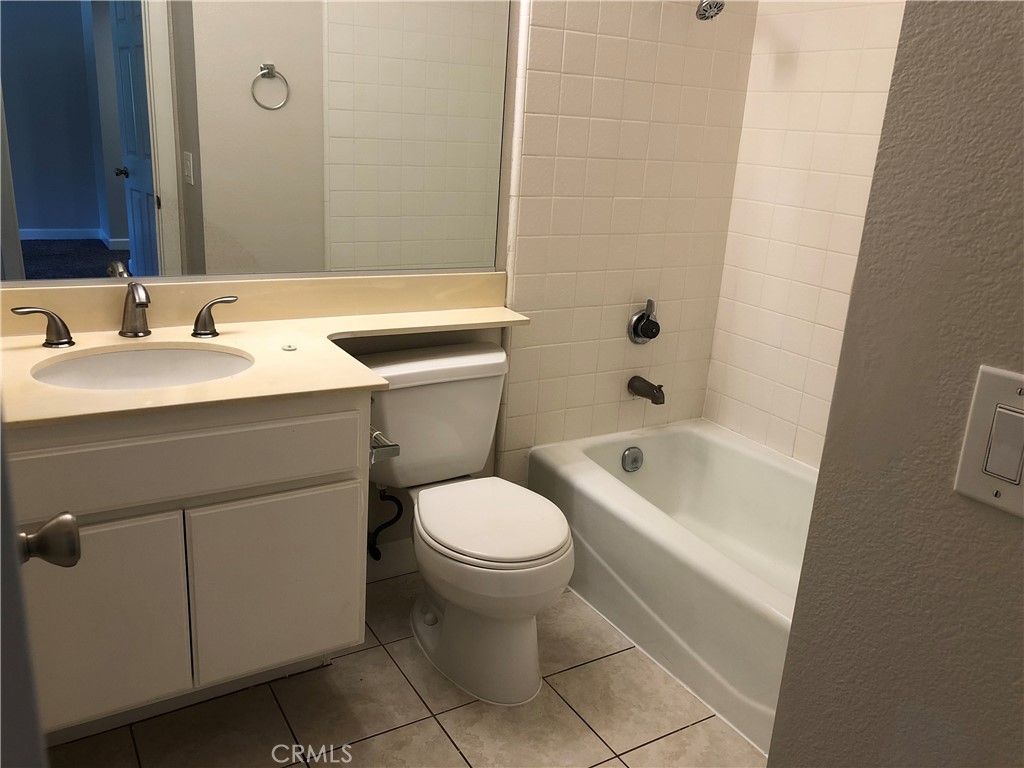 16 Prescott Irvine, CA 92620 - Photo 19 of 23 a bathroom with a sink toilet and shower