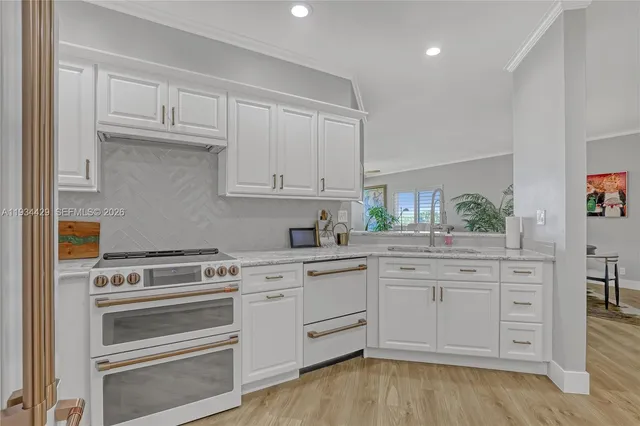 a view of livingroom with washer and dryer