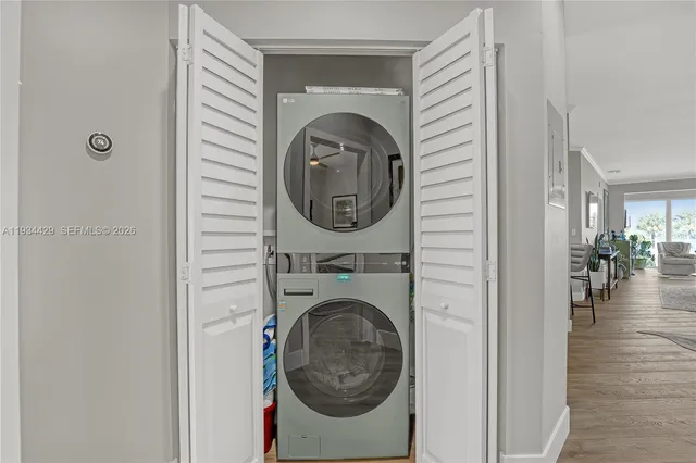 a bedroom with a bed and windows