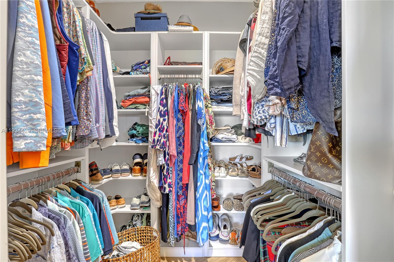 6062 Southeast Landing Way, Unit 16 Stuart, FL 34997 - Photo 22 of 35 a view of walk in closet with clothes