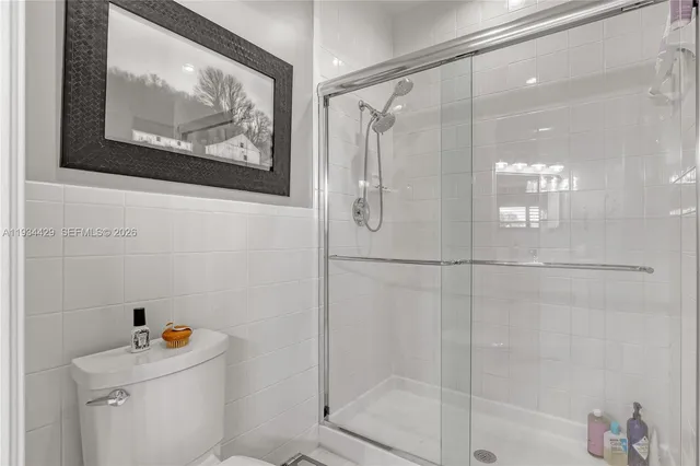 a bedroom with a bed and a television