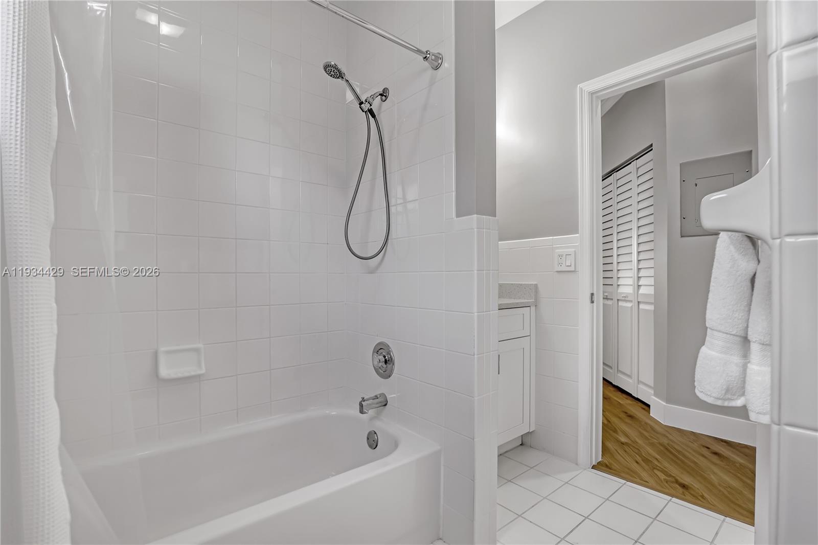 6062 Southeast Landing Way, Unit 16 Stuart, FL 34997 - Photo 28 of 35 a bathroom with a bath tub and a shower