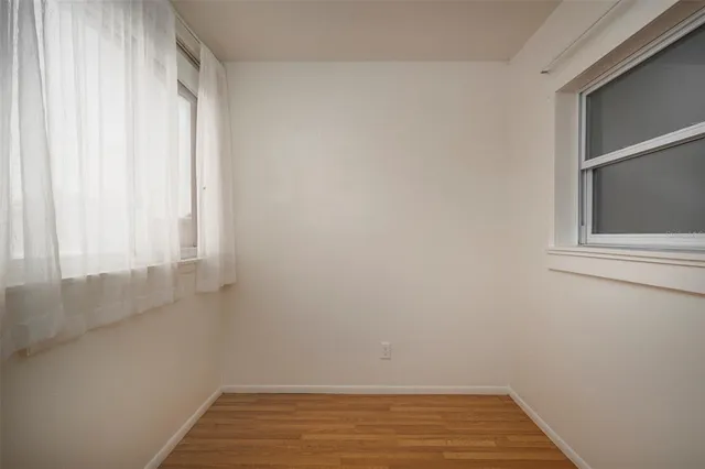 a view of a livingroom with wooden floor