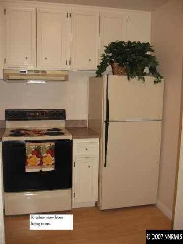 2750 Plumas Street, Unit 301 Reno, NV 89509 - Photo 4 of 7 a kitchen with a stove and cabinets