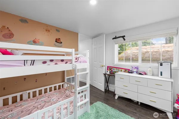 a bed room with a bed and a window