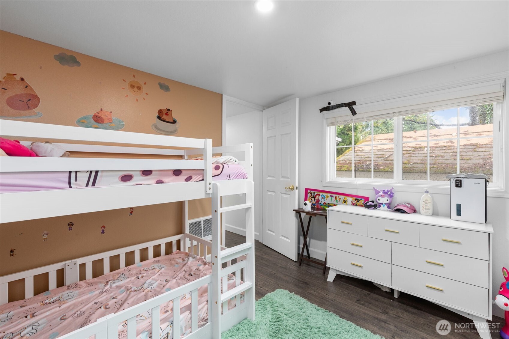 23708 Locust Way, Unit 23 Bothell, WA 98021 - Photo 12 of 24 a room with baby crib and dresser