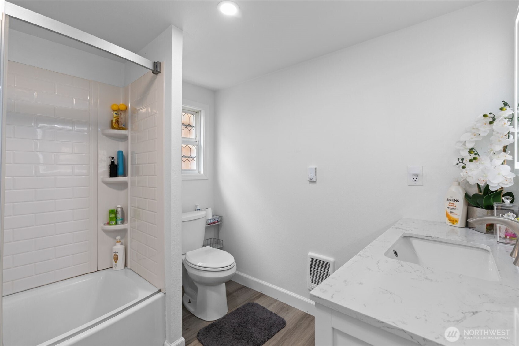 23708 Locust Way, Unit 23 Bothell, WA 98021 - Photo 14 of 24 a bathroom with a sink a toilet and shower