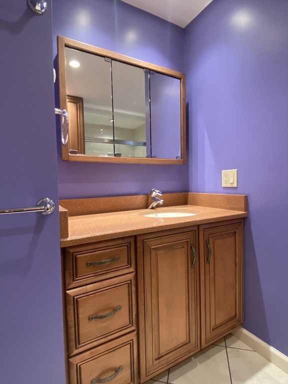 5 Ryan Road, Unit A Gloucester, MA 01930 - Photo 18 of 28 a bathroom with a sink and a mirror