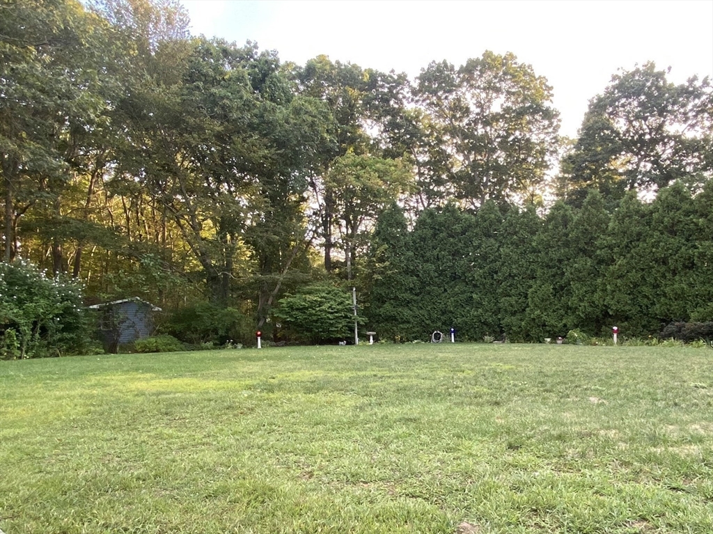 5 Ryan Road, Unit A Gloucester, MA 01930 - Photo 27 of 28 a backyard of a house with lots of green space