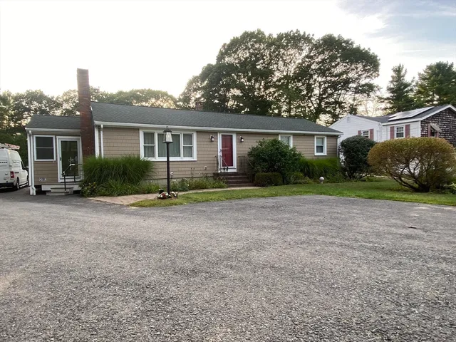 front view of a house with a yard