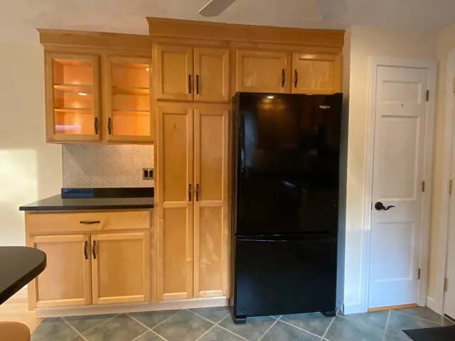 a view of walk in closet with empty room