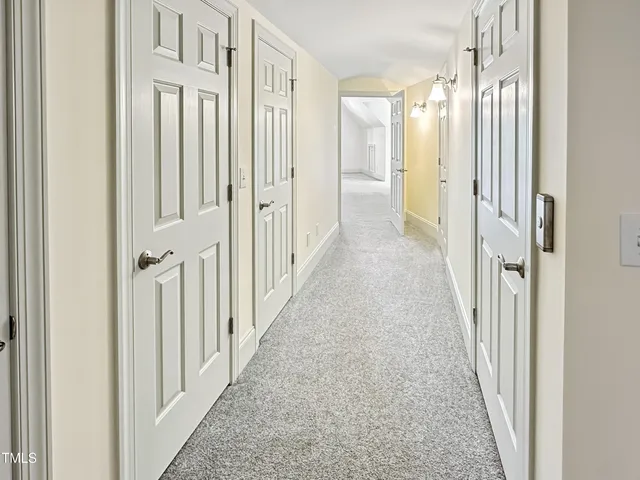 a spacious bathroom with a double vanity sink a mirror and a shower