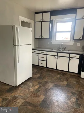 a view of a kitchen with a sink
