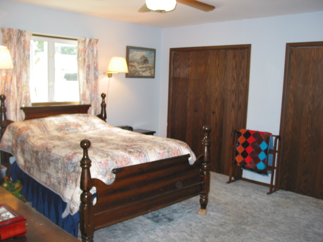 64 Eastfield Road Montgomery, IL 60538 - Photo 13 of 22 a bedroom with a bed and a window