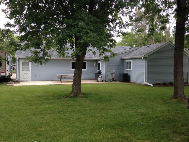 64 Eastfield Road Montgomery, IL 60538 - Photo 3 of 22 a front view of house with yard and green space