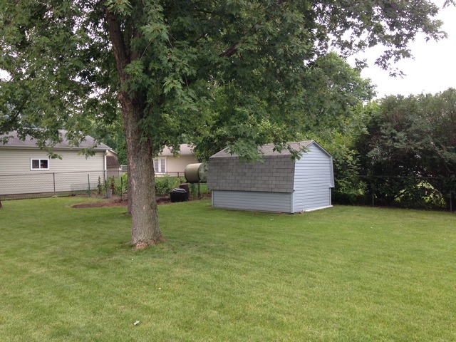 64 Eastfield Road Montgomery, IL 60538 - Photo 5 of 22 a backyard of a house with lots of green space